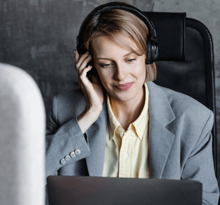 Captioner working on closed captioning services in Maryland ensuring 99% accuracy with proper tone and speaker labeling.