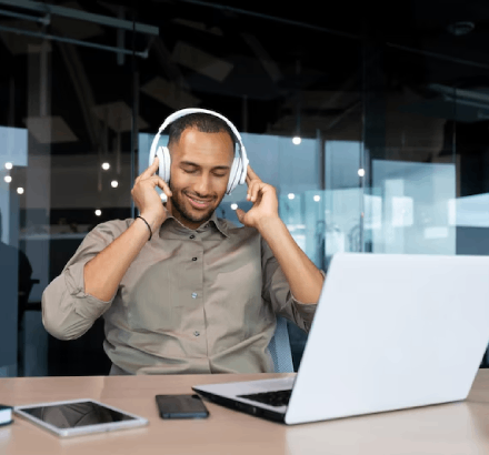 Man understanding the audio with headphones, illustrating the process of professional audio description services.