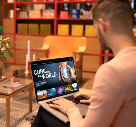 A viewer uses closed captioning for better comprehension during a webcast, enhancing inclusivity and viewer engagement.