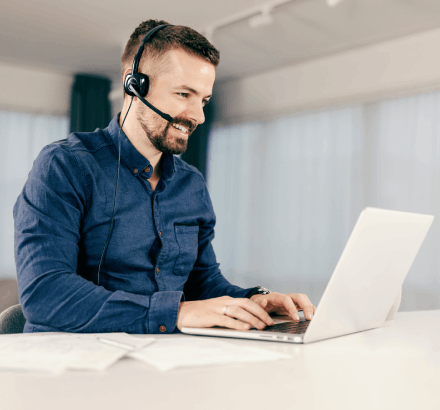 Corporate trainer using closed captioning services in Norfolk to enhance learning accessibility for employees.