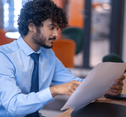 Compliance officer reviewing offline captioning documentation with FCC quality standards and ADA CVAA legal requirements