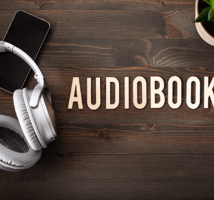 Close-up of audio-books representing improved learning in corporate training through audio description services.
