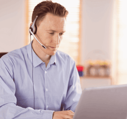 A customer listens to a descriptive video created by closed captioning services in Houston for better accessibility.