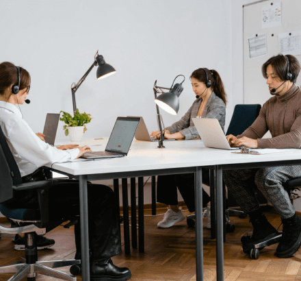 A team of professionals providing English to Spanish closed captioning services, enhancing content accessibility.