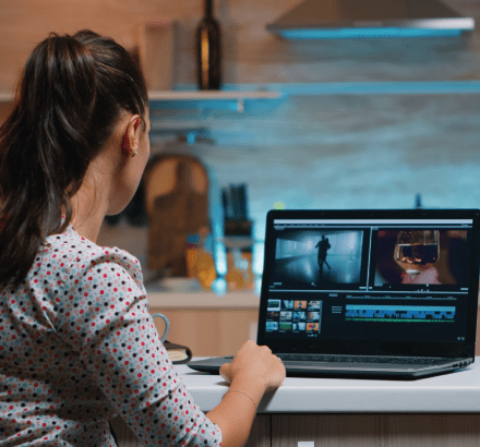 Captioner working on closed captioning for a film, ensuring precise and clear captions for an improved viewing experience.