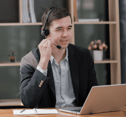 Business man using Ga language subtitling services ensure content reaches Ga speaking audiences globally with accuracy.