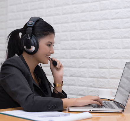 A professional benefits from Hindi subtitles in a business, ensuring all understand key points in training videos.