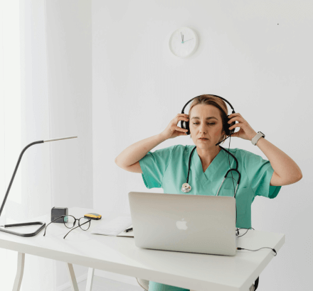 Doctor reviewing the videos from specialized medical captioning services in French for clear communication in healthcare.