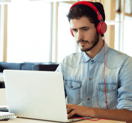 The student is benefiting from closed captioning services in New York to improve reading speed and comprehension.