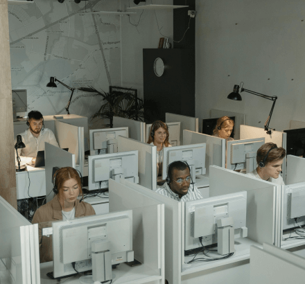 Experts team working in an office, depicting the versatility of Russian captioning services for various types of videos.