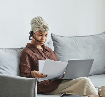 Focused woman reviewing documents on a transcription services that document church sermons and events with accuracy.