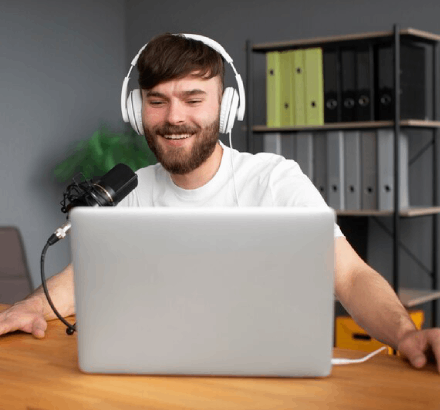 Smiling man reviewing the voice-over, highlighting the clarity and quality in voice-over recording for audio descriptions.